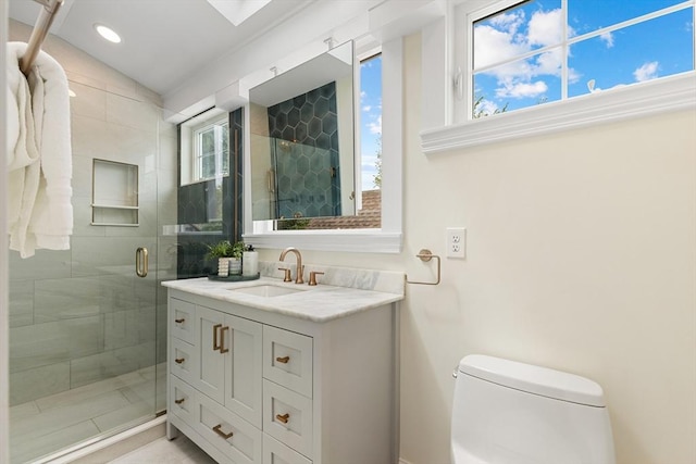 17 Perry St, Somerville, MA 02143 - bathroom with toilet, vanity, a stall shower, and recessed lighting