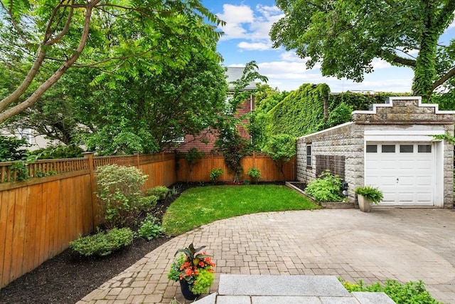 17 Perry St, Somerville, MA 02143 - view of yard featuring a garage and driveway