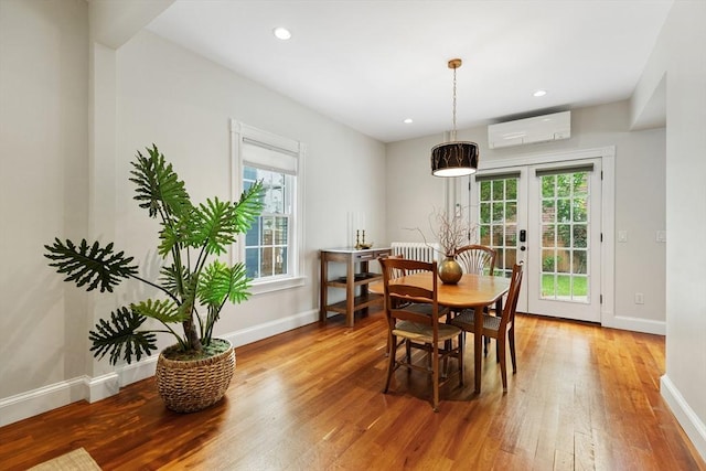 17 Perry St, Somerville, MA 02143 - dining room featuring a wall mounted AC, healthy amount of natural light, light wood-style floors, baseboards, and recessed lighting
