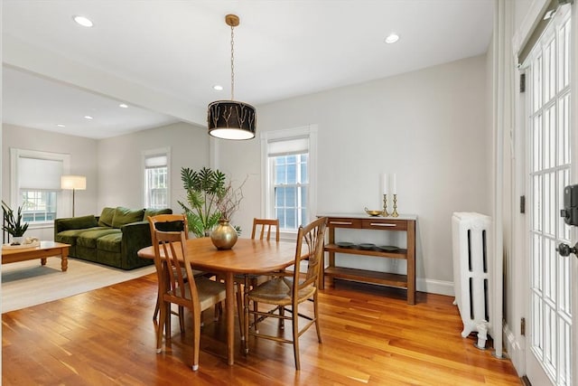 17 Perry St, Somerville, MA 02143 - dining space featuring radiator heating unit, light wood finished floors, recessed lighting, and baseboards