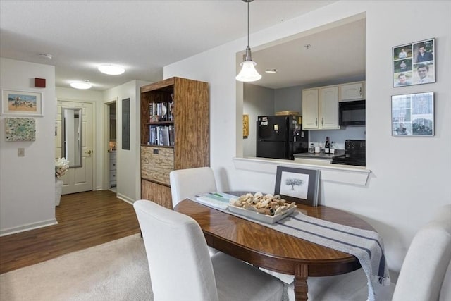 dining area featuring wood-type flooring