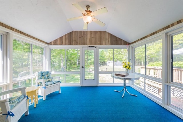 sunroom / solarium featuring lofted ceiling and ceiling fan