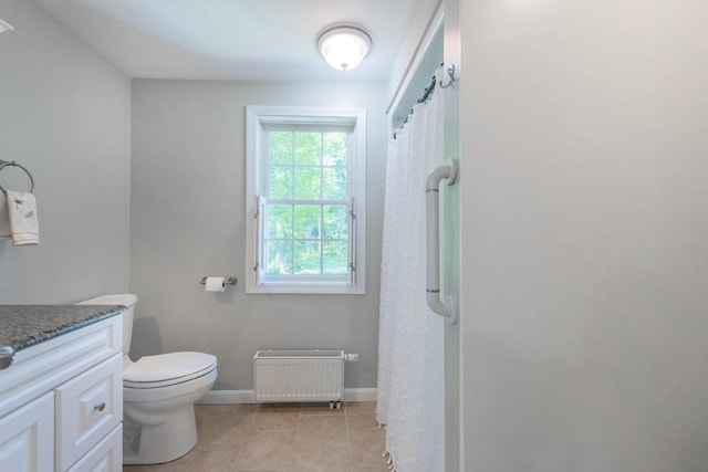 bathroom with radiator heating unit, vanity, toilet, tile patterned flooring, and a shower with shower curtain
