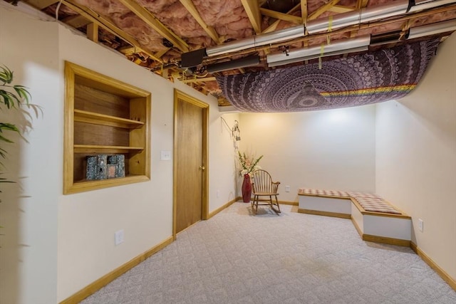 finished below grade area featuring carpet floors and baseboards
