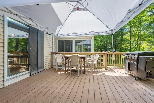wooden deck with outdoor dining space