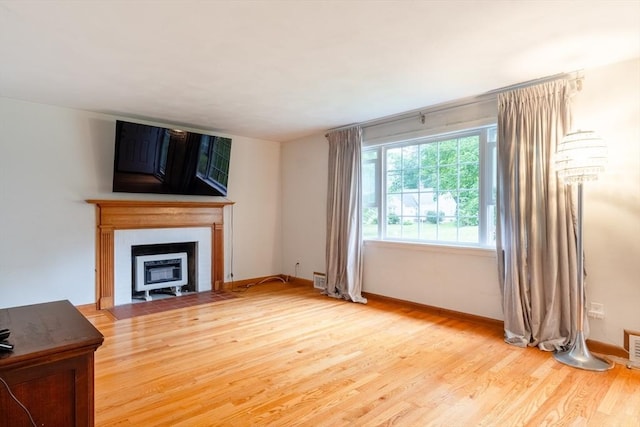 31 Melwood Ave, East Longmeadow, MA 01028 - unfurnished living room featuring wood finished floors and a fireplace with flush hearth