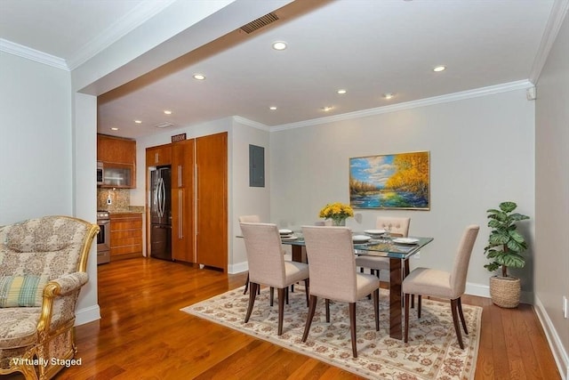 148 Greenbrook Dr Unit 69-6, Stoughton, MA 02072 - dining area with wood finished floors, crown molding, recessed lighting, and baseboards