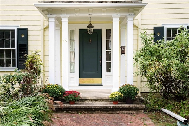 view of exterior entry with covered porch