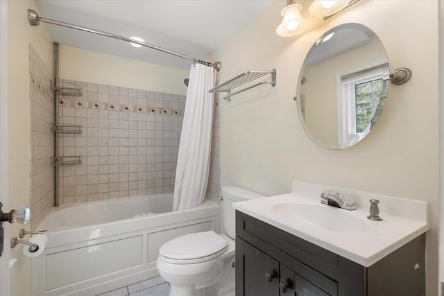 full bath with tile patterned flooring, shower / tub combo with curtain, toilet, and vanity