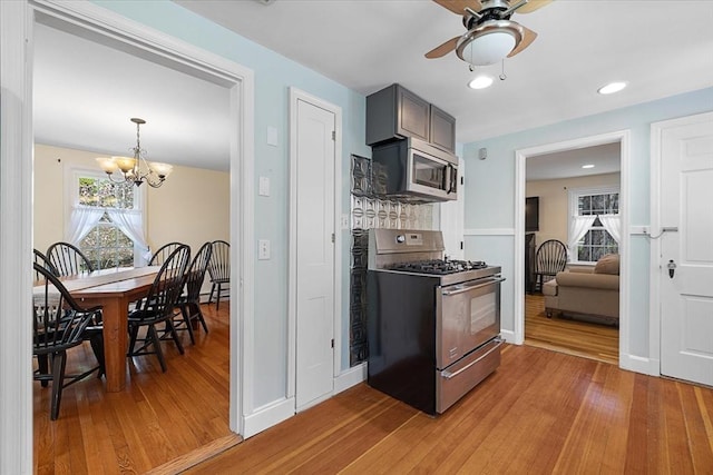 kitchen featuring light wood finished floors, appliances with stainless steel finishes, and a wealth of natural light