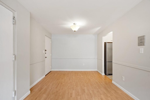 unfurnished room featuring light hardwood / wood-style flooring