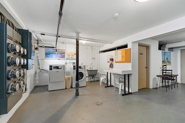 basement with washer and clothes dryer