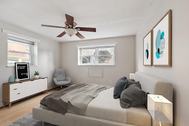 bedroom featuring ceiling fan and light wood-type flooring