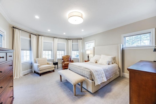 bedroom featuring multiple windows, light carpet, and ornamental molding