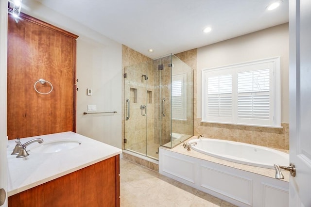 bathroom featuring separate shower and tub, tile patterned flooring, and vanity