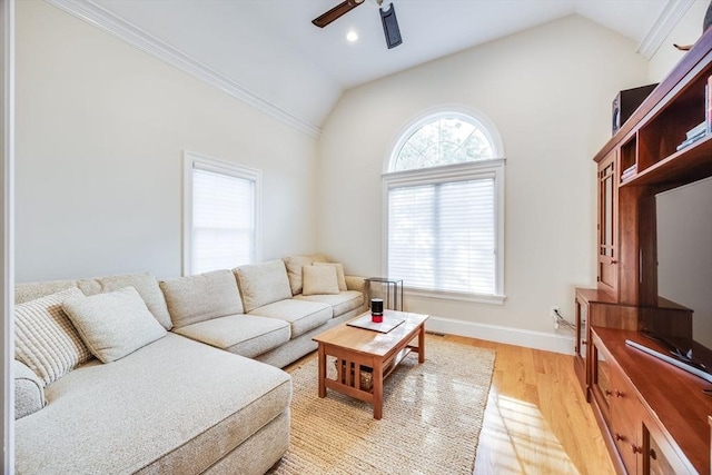 living room with ceiling fan, light hardwood / wood-style flooring, and a healthy amount of sunlight