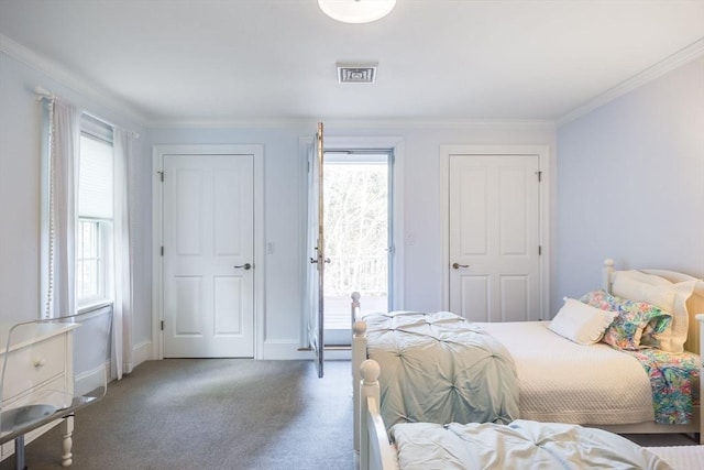 bedroom featuring dark carpet and ornamental molding