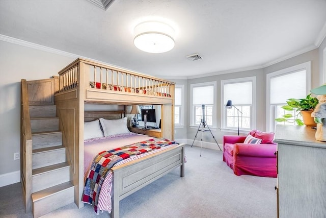 carpeted bedroom featuring crown molding