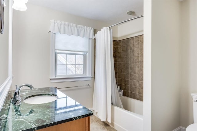 full bathroom featuring toilet, vanity, tile patterned floors, and shower / bath combo with shower curtain