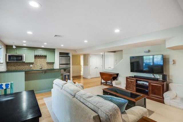 living room with light hardwood / wood-style floors