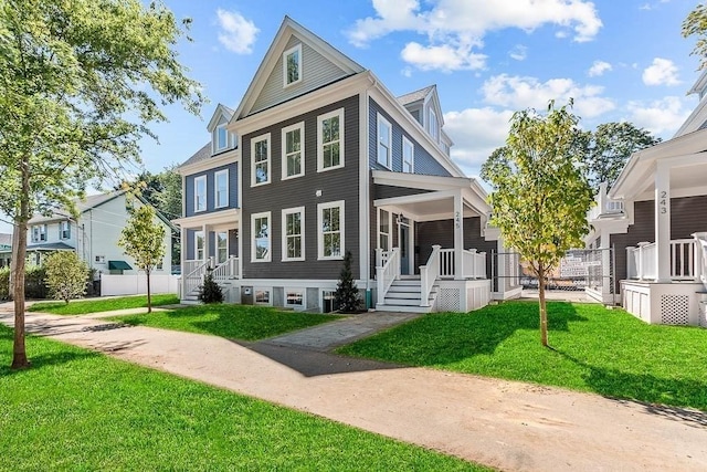 view of front facade with covered porch and a front lawn