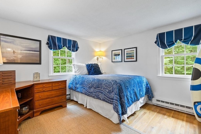10 Granada Way, Andover, MA 01810 - bedroom with baseboard heating and wood finished floors