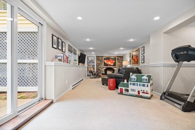 10 Granada Way, Andover, MA 01810 - playroom featuring carpet floors, a stone fireplace, a baseboard heating unit, recessed lighting, and wainscoting