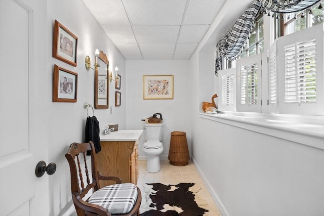 10 Granada Way, Andover, MA 01810 - bathroom featuring a drop ceiling, vanity, toilet, healthy amount of natural light, and tile patterned flooring