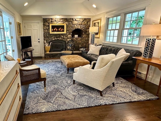 10 Granada Way, Andover, MA 01810 - living room with vaulted ceiling, wood finished floors, a fireplace, and baseboard heating