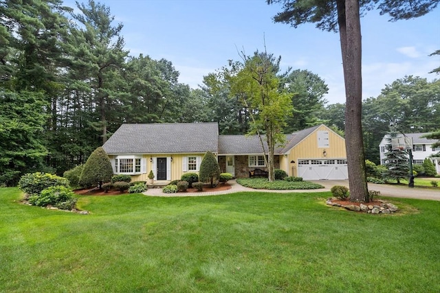 10 Granada Way, Andover, MA 01810 - view of front of house with an attached garage, driveway, and a front lawn