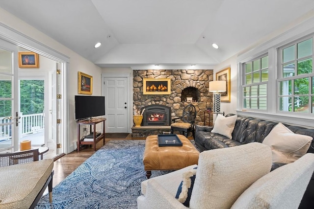 10 Granada Way, Andover, MA 01810 - living area with vaulted ceiling, wood finished floors, and a fireplace