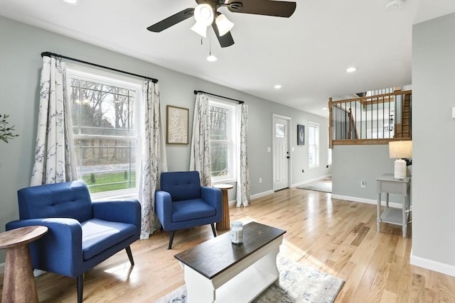 sitting room with recessed lighting, light wood finished floors, ceiling fan, and baseboards