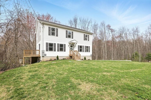 view of front of property with a front lawn and a deck