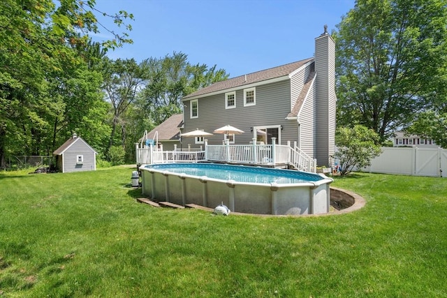 12 Bonin Dr, Haverhill, MA 01832 - back of house featuring a deck and a chimney
