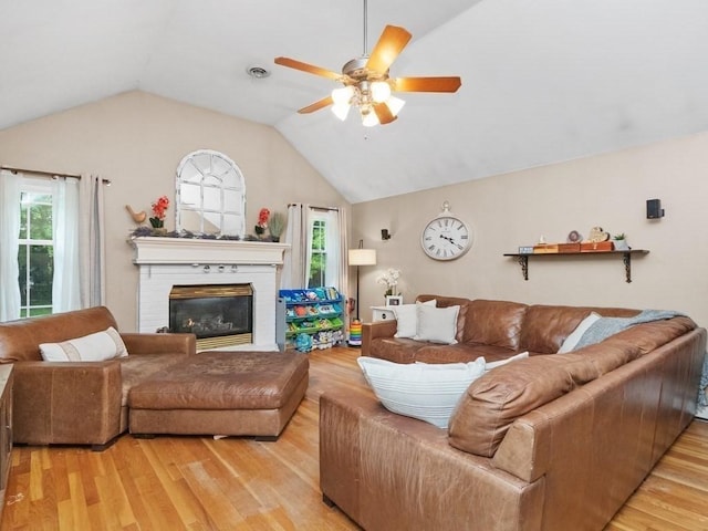 48 Twin Brook Ln, Taunton, MA 02780 - living room featuring wood finished floors, ceiling fan, lofted ceiling, and a fireplace