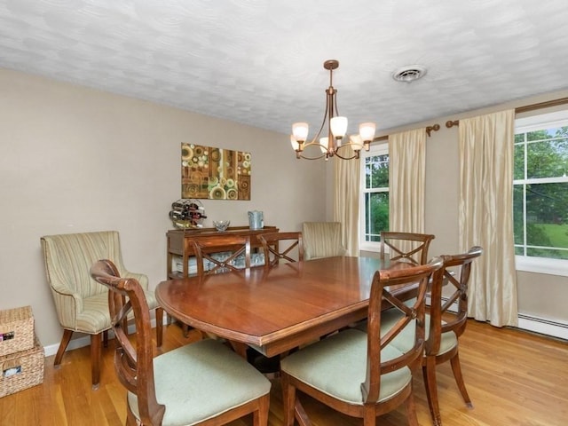 48 Twin Brook Ln, Taunton, MA 02780 - dining area featuring light wood-style floors and a chandelier