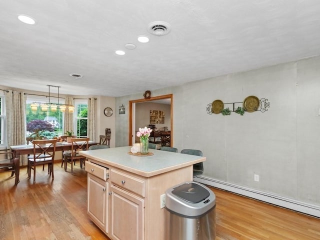 48 Twin Brook Ln, Taunton, MA 02780 - kitchen with light brown cabinetry, light wood finished floors, light countertops, recessed lighting, and a center island