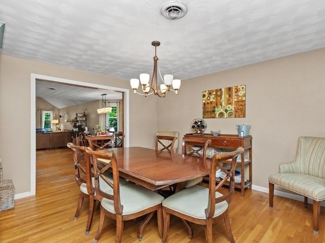 48 Twin Brook Ln, Taunton, MA 02780 - dining space featuring a chandelier, light wood-style floors, baseboards, and a textured ceiling