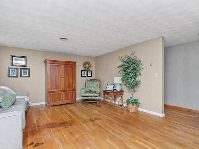 48 Twin Brook Ln, Taunton, MA 02780 - sitting room with light wood-style flooring and baseboards