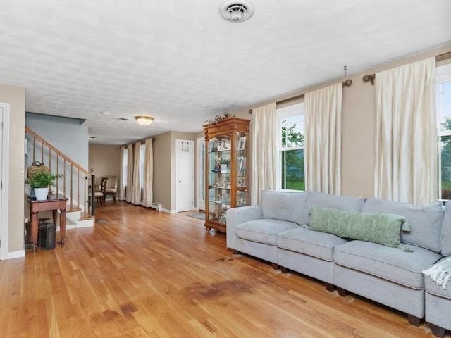 48 Twin Brook Ln, Taunton, MA 02780 - living area with light wood-style flooring, stairs, and baseboards