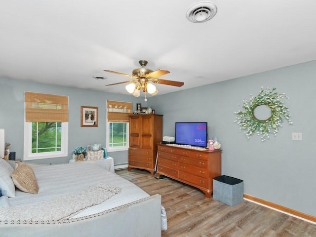 48 Twin Brook Ln, Taunton, MA 02780 - bedroom with light wood finished floors, a baseboard heating unit, baseboards, and ceiling fan