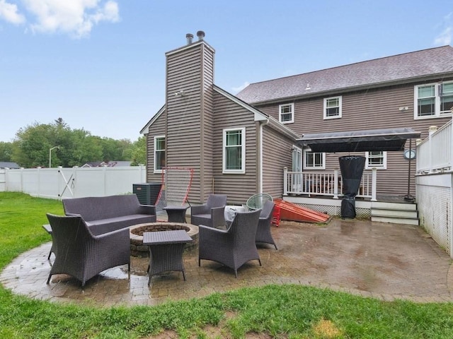 48 Twin Brook Ln, Taunton, MA 02780 - rear view of house featuring a patio, a wooden deck, a chimney, a fenced backyard, and central air condition unit