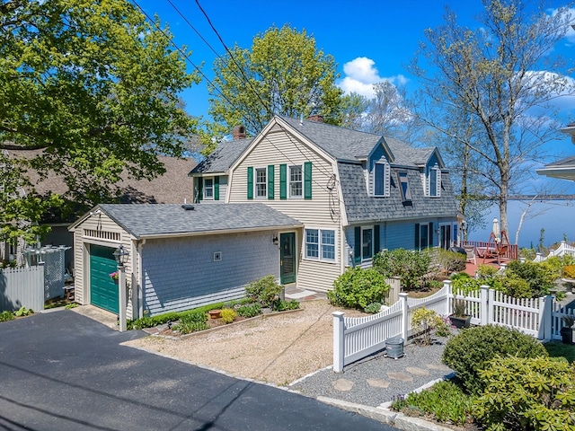 view of front of house with an outdoor structure and a garage