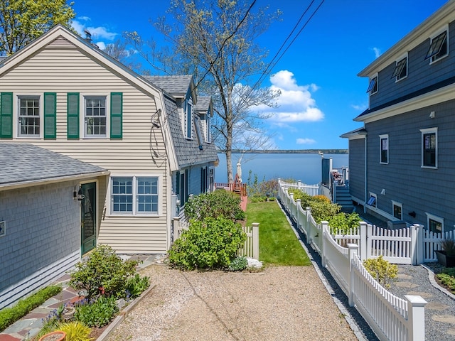 view of home's exterior with a water view