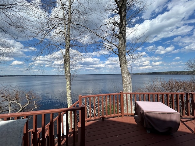 wooden terrace with a water view