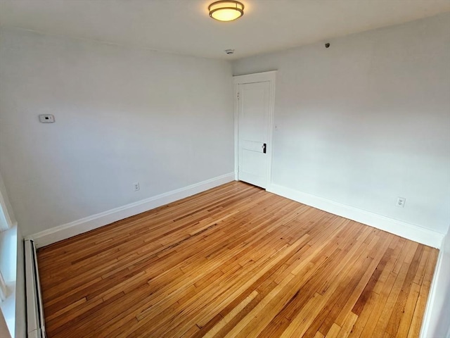 spare room featuring hardwood / wood-style floors