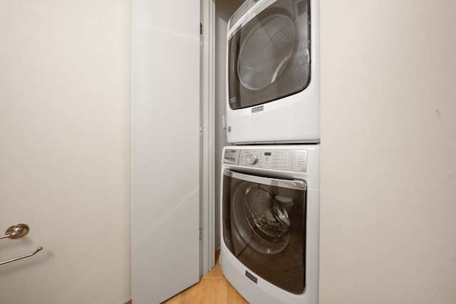 laundry room with stacked washer / drying machine