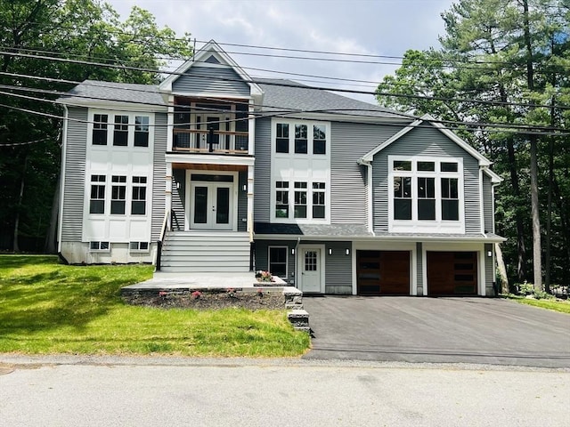 1 Harvard Ave, Burlington, MA 01803 - view of front of house featuring a balcony, an attached garage, driveway, and french doors