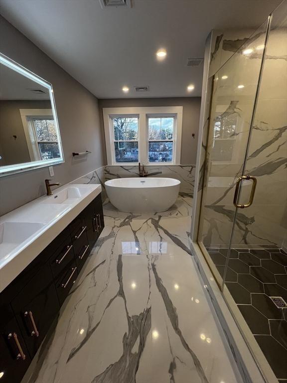 1 Harvard Ave, Burlington, MA 01803 - bathroom with double vanity, a marble finish shower, a freestanding bath, marble tiled flooring, and recessed lighting