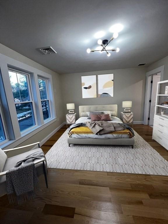 1 Harvard Ave, Burlington, MA 01803 - bedroom with a chandelier and wood finished floors